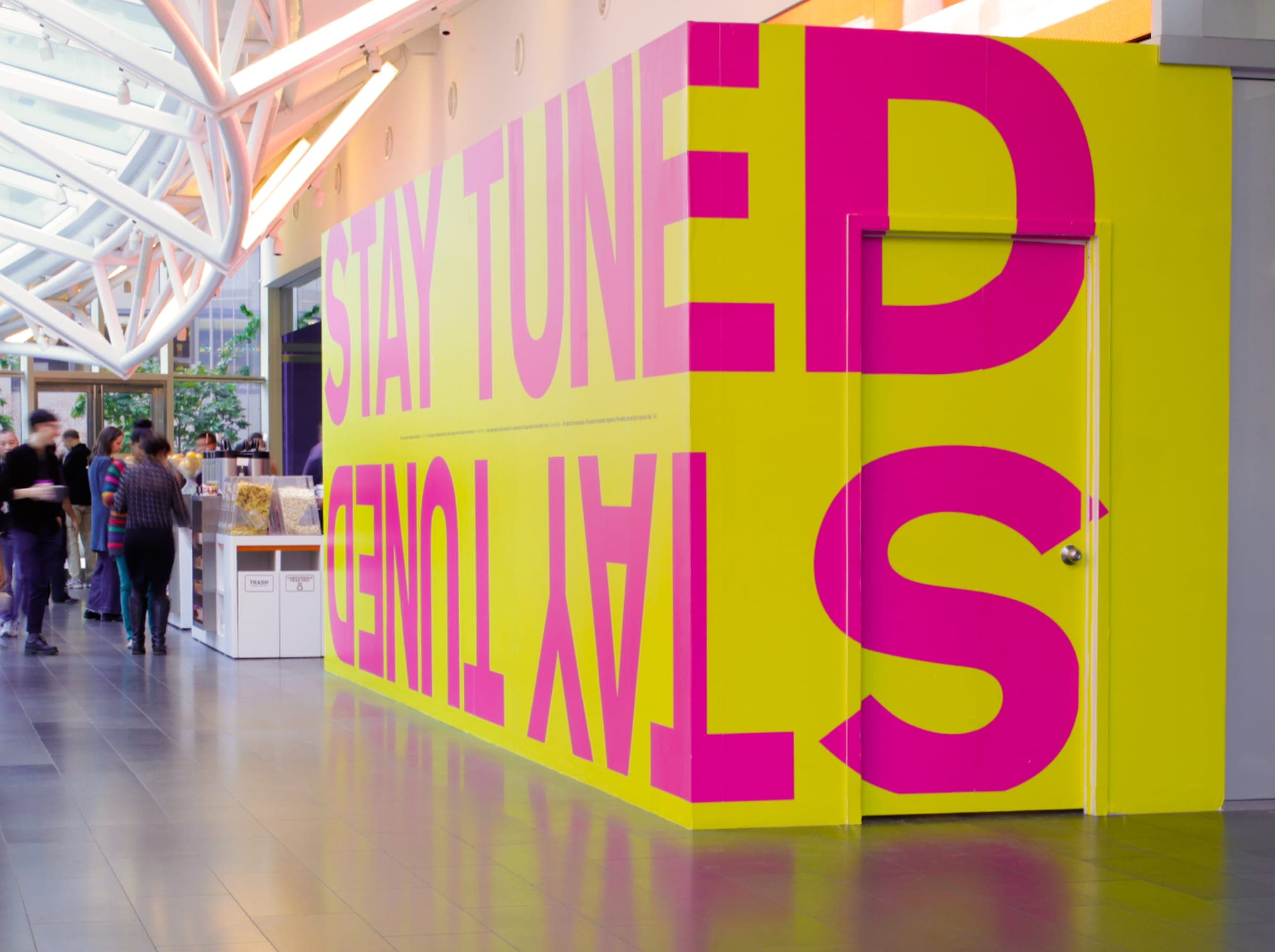 Bloomberg construction wall mural — bold typographic quotes about progress and patience